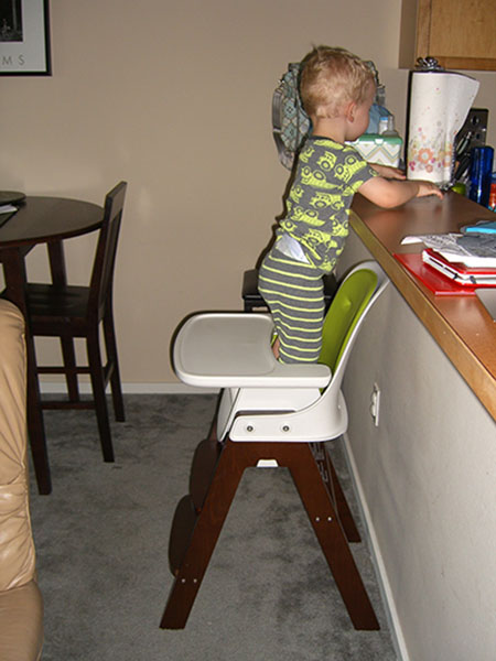 baby-boy-standing-high-chair