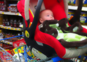 car seat on top of shopping cart