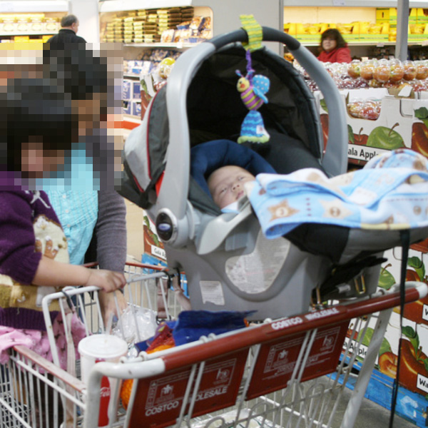 car seat on top of shopping cart