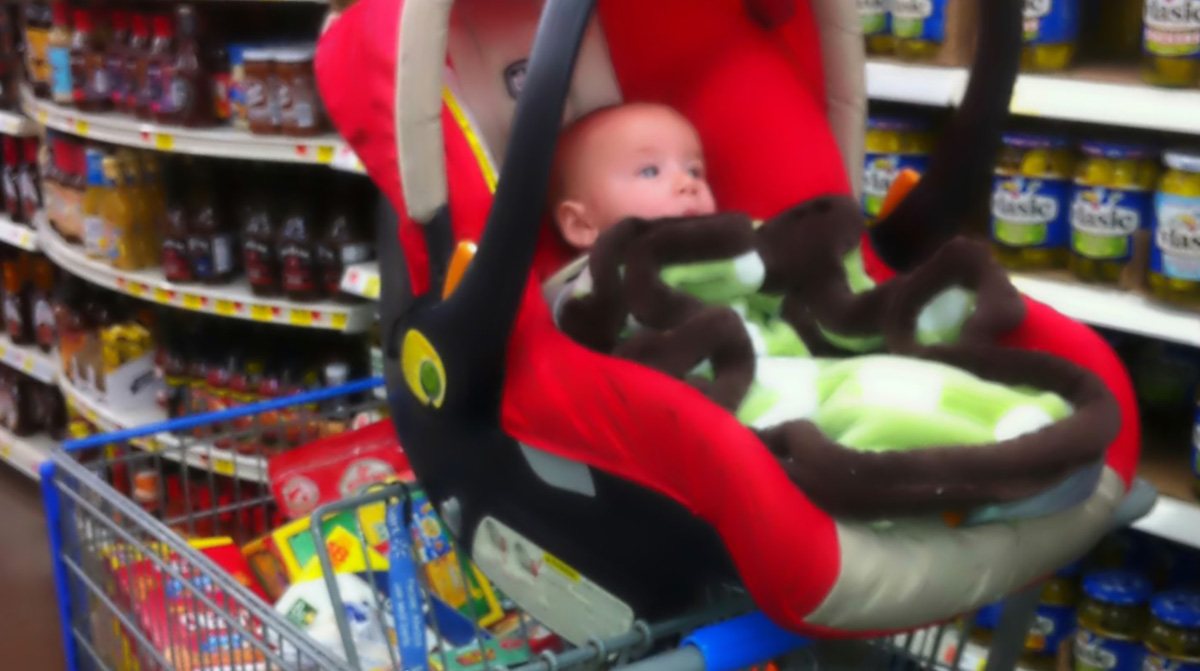 car seat on top of shopping cart